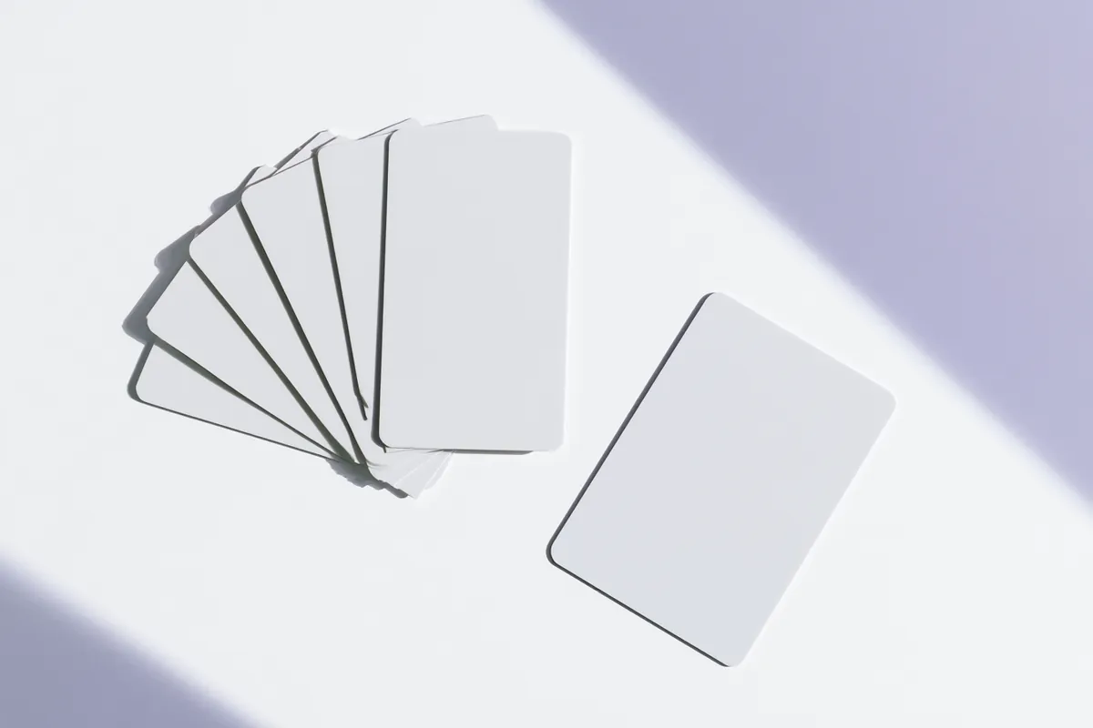 Several credit cards fanned beside a single card, illustrating consolidation through Uplyft Capital